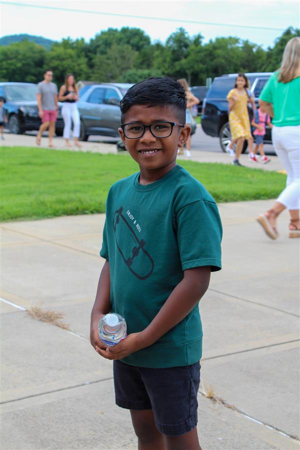 Students walking in on the first day of school. 